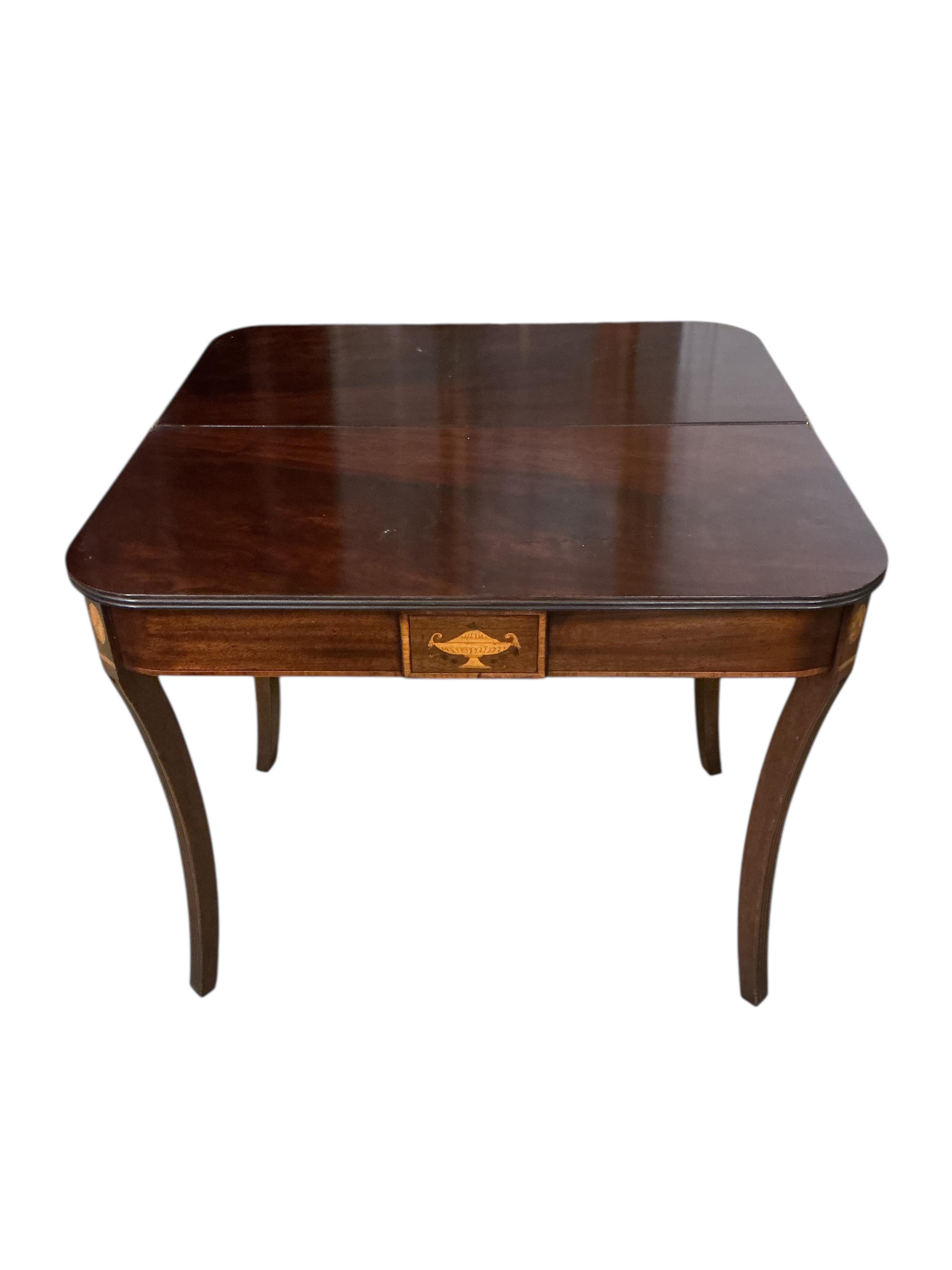 A George III style inlaid mahogany folding tea table, width 91cm, depth 44cm, height 72cm